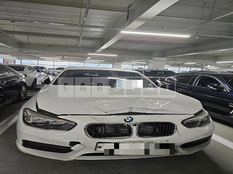 Photo 2 of 11: 2018 BMW 118d, VIN WBA1S5100J5L14372 — Korean insurance auction