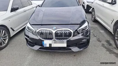 Photo 1 of 13: 2021 BMW 120i, VIN WBA7L7105M7J24692 — Korean insurance auction