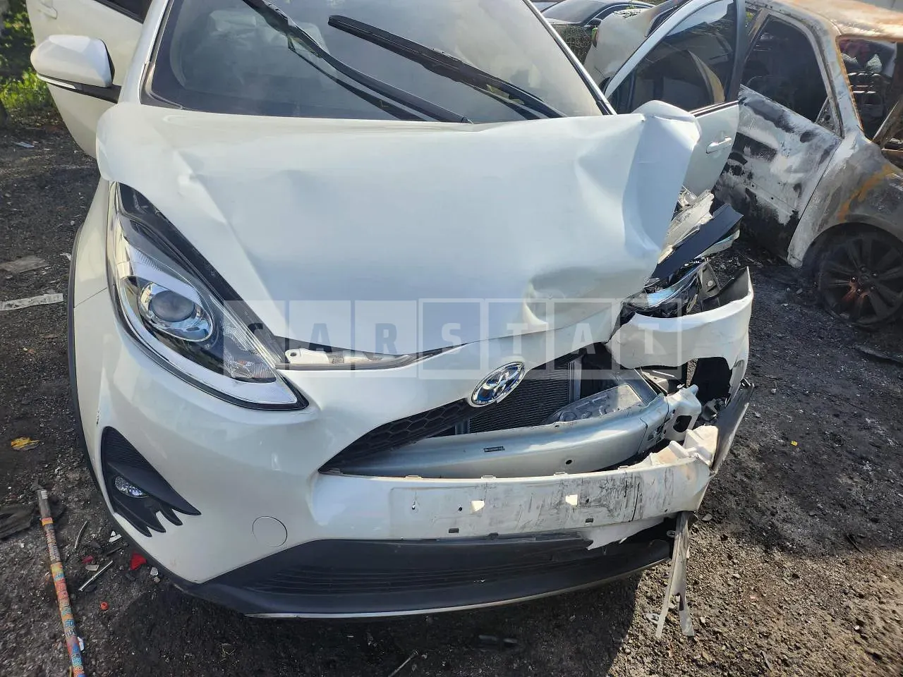 Photo 2 of 11: 2021 Toyota Prius C, VIN JTDKDTB30M1149854 — Korean insurance auction