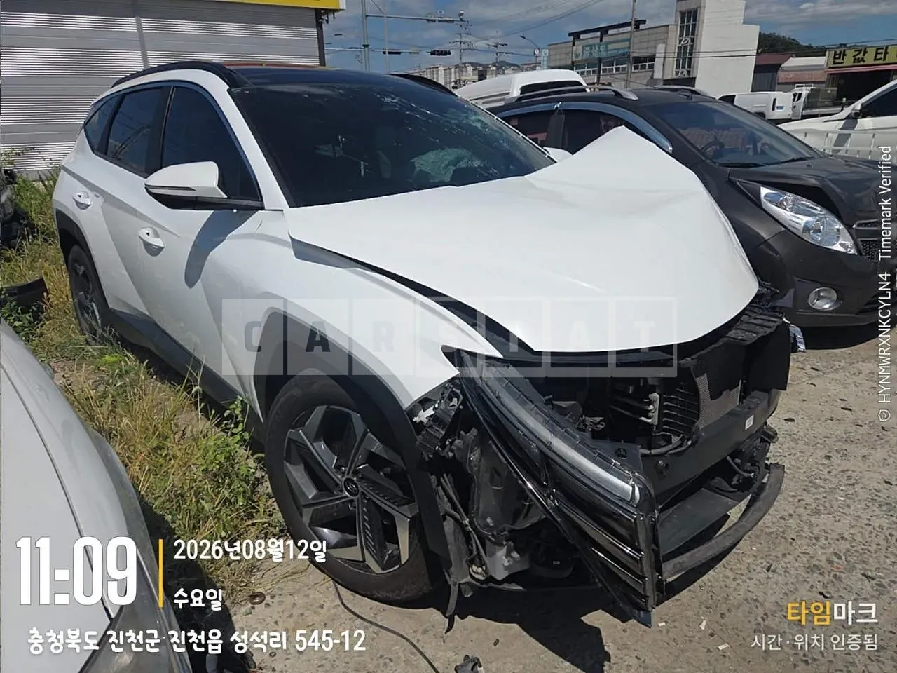 Photo 2 of 12: 2021 Hyundai Tucson, VIN KMHJC81BGMU001390 — Korean insurance auction