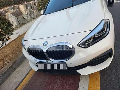 Photo 1 of 24: 2021 BMW 118d, VIN WBA7M9101M5S97775 — Korean insurance auction